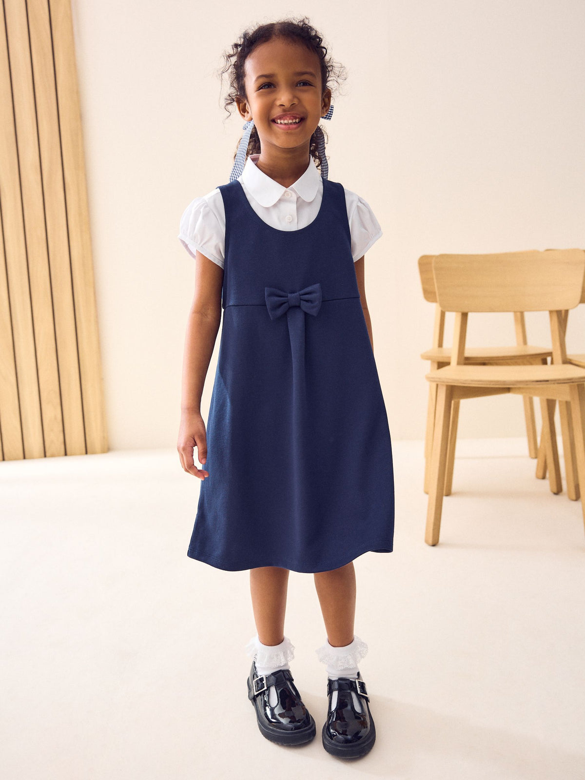 Navy Jersey Stretch Bow School Pinafore (3-14yrs)